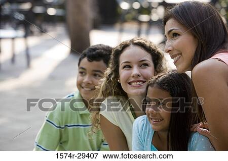 People sitting together and smiling View Large Photo Image Stock Photo - People sitting together and smiling. Fotosearch