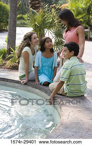 People sitting together by water View Large Photo Image Stock Image - People sitting together by water. Fotosearch