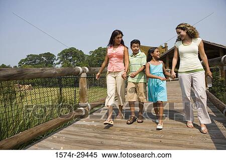 People walking together on board walk View Large Photo Image Stock Photography - People walking together on board walk. Fotosearch