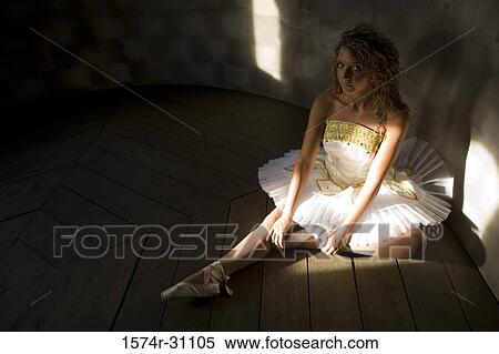 Portrait of a ballet dancer sitting on hardwood floor View Large Photo Image Stock Photography - Portrait of a ballet dancer sitting on hardwood floor. Fotosearch