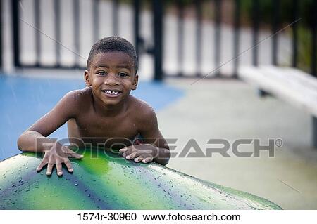 Portrait of a boy on a tortoise sculpture View Large Photo Image Stock Image - Portrait of a boy on a tortoise sculpture. Fotosearch