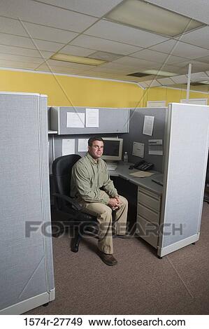 Portrait of a businessman sitting in an office View Large Photo Image Stock Photo - Portrait of a businessman sitting in an office. Fotosearch