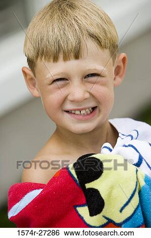 Portrait of a Cheerful boy with towel View Large Photo Image Stock Photograph - Portrait of a Cheerful boy with towel. Fotosearch