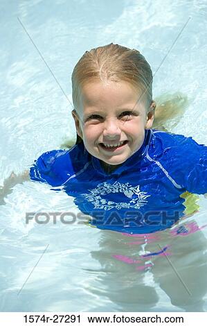 Portrait of a cheerful girl in swimming pool View Large Photo Image Stock Image - Portrait of a cheerful girl in swimming pool. Fotosearch