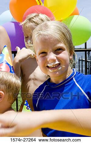 Portrait of a cheerful girl with her friends in background View Large Photo Image Picture - Portrait of a cheerful girl with her friends in background. Fotosearch