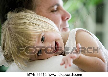 Stock Image - Portrait of a cheerful girl with her father. Fotosearch