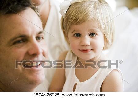 Portrait of a cheerful girl with her father View Large Photo Image Stock Photography - Portrait of a cheerful girl with her father. Fotosearch