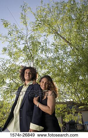 Portrait of a cheerful man and a mature woman standing together View Large Photo Image Stock Photo - Portrait of a cheerful man and a mature woman standing together. Fotosearch