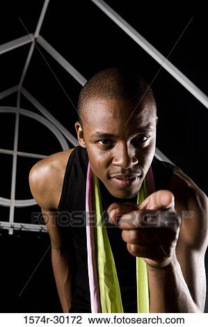Portrait of a cheerful man pointing out finger View Large Photo Image Stock Image - Portrait of a cheerful man pointing out finger. Fotosearch
