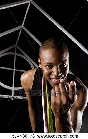 Portrait of a cheerful man pointing finger View Large Photo Image Stock Image - Portrait of a cheerful man pointing finger. Fotosearch