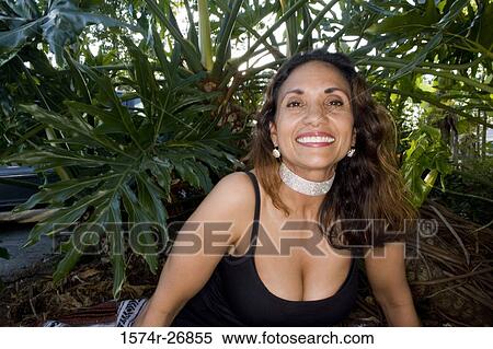 Portrait of a cheerful mature woman in low neck black dress View Large Photo Image Stock Photography - Portrait of a cheerful mature woman in low neck black dress. Fotosearch