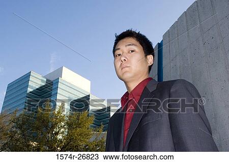 Portrait of a contemplative young businessman View Large Photo Image Stock Image - Portrait of a contemplative young businessman. Fotosearch