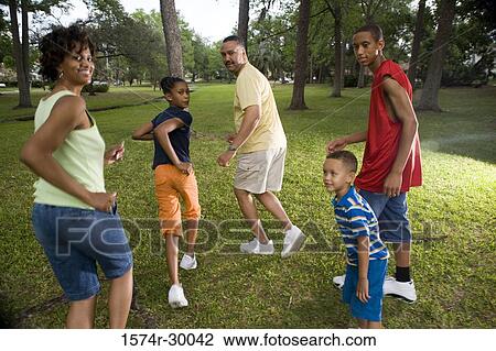 Portrait of a family running at park View Large Photo Image Stock Image - Portrait of a family running at park. Fotosearch