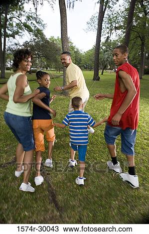 Portrait of a family running at park View Large Photo Image Stock Image - Portrait of a family running at park. Fotosearch