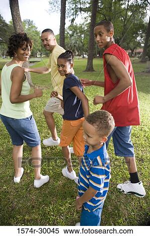 Portrait of a family running at park View Large Photo Image Stock Photography - Portrait of a family running at park. Fotosearch