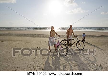 Portrait of a family with bicycles at the beach View Large Photo Image Stock Image - Portrait of a family with bicycles at the beach. Fotosearch