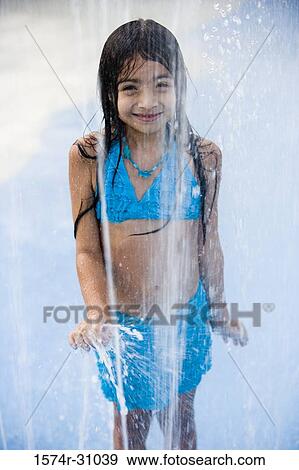 Portrait of a girl standing by shower View Large Photo Image Stock Photo - Portrait of a girl standing by shower. Fotosearch