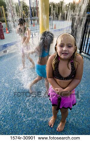 Portrait of a girl standing in front of a shower View Large Photo Image Stock Image - Portrait of a girl standing in front of a shower. Fotosearch