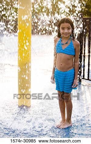 Portrait of a girl standing under a shower View Large Photo Image Stock Photography - Portrait of a girl standing under a shower. Fotosearch