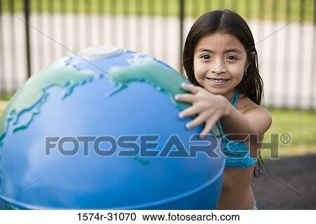 Portrait of a girl with inflated globe View Large Photo Image Stock Image - Portrait of a girl with inflated globe. Fotosearch