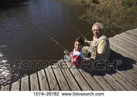 Portrait of a grandfather fishing with his grandson at the lake View Large Photo Image Stock Image - Portrait of a grandfather fishing with his grandson at the lake. Fotosearch