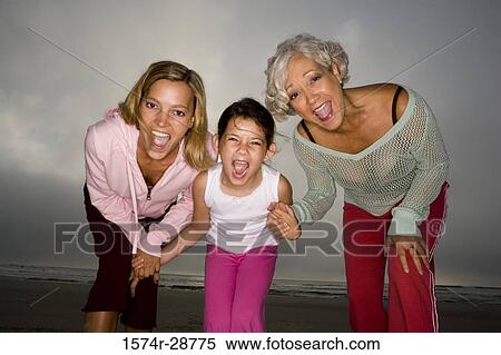 Portrait of a grandmother enjoying with her daughter and granddaughter at the beach View Large Photo Image Stock Photography - Portrait of a grandmother enjoying with her daughter and granddaughter at the beach. Fotosearch