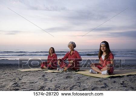 Portrait of a grandmother with her daughter and granddaughter exercising at the beach View Large Photo Image Stock Image - Portrait of a grandmother with her daughter and granddaughter exercising at the beach. Fotosearch