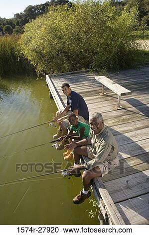 Portrait of a man fishing with his son and friend on jetty View Large Photo Image Stock Image - Portrait of a man fishing with his son and friend on jetty. Fotosearch