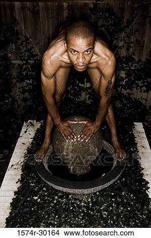 Portrait of a man standing on a round structure View Large Photo Image Picture - Portrait of a man standing on a round structure. Fotosearch