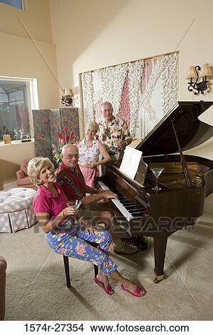 Portrait of a senior people sitting by piano View Large Photo Image Picture - Portrait of a senior people sitting by piano. Fotosearch