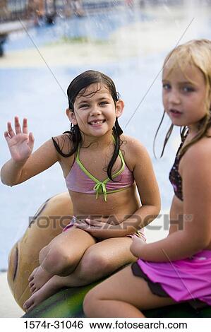 Portrait of a smiling girl with a friend waving View Large Photo Image Stock Photograph - Portrait of a smiling girl with a friend waving. Fotosearch