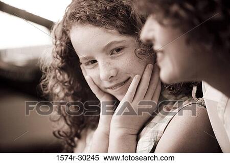 Portrait of a smiling girl with her mother View Large Photo Image Stock Photography - Portrait of a smiling girl with her mother. Fotosearch