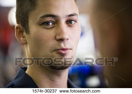 Portrait of a smiling man in a bicycle shop View Large Photo Image Stock Photo - Portrait of a smiling man in a bicycle shop. Fotosearch