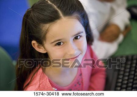 Stock Photo - Portrait of a smiling schoolgirl. Fotosearch