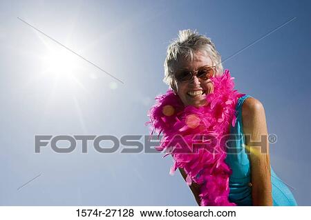 Portrait of a smiling senior woman with fur and sunglasses View Large Photo Image Stock Photo - Portrait of a smiling senior woman with fur and sunglasses. Fotosearch