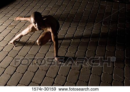 Portrait of a young man crawling on the tiled floor View Large Photo Image Stock Photo - Portrait of a young man crawling on the tiled floor. Fotosearch