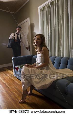Portrait of a young prostitute holding a rose while mid adult man opening a door View Large Photo Image Stock Image - Portrait of a young prostitute holding a rose while mid adult man opening a door. Fotosearch