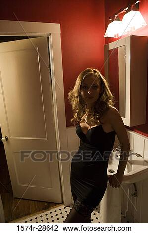 Portrait of a young prostitute in a gown leaning by sink View Large Photo Image Stock Image - Portrait of a young prostitute in a gown leaning by sink. Fotosearch