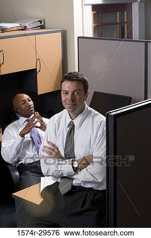Portrait of business people sitting in an office View Large Photo Image Stock Photograph - Portrait of business people sitting in an office. Fotosearch