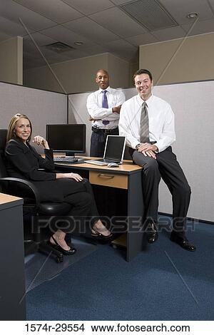 Picture - Portrait of business people smiling in an office. Fotosearch