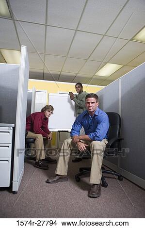 Portrait of businessmen by chart board in an office View Large Photo Image Picture - Portrait of businessmen by chart board in an office. Fotosearch