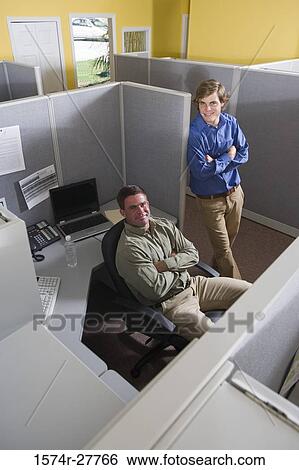 Portrait of businessmen smiling in an office View Large Photo Image Stock Photograph - Portrait of businessmen smiling in an office. Fotosearch