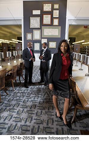 Stock Photo - Portrait of businesspeople standing in an office. Fotosearch