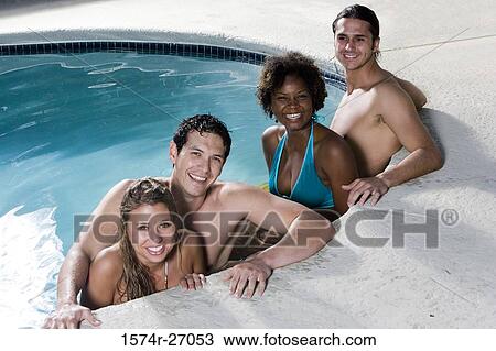 Portrait of cheerful friends in swimming pool View Large Photo Image Stock Image - Portrait of cheerful friends in swimming pool. Fotosearch
