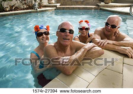 Portrait of cheerful senior couples in swimming pool View Large Photo Image Picture - Portrait of cheerful senior couples in swimming pool. Fotosearch
