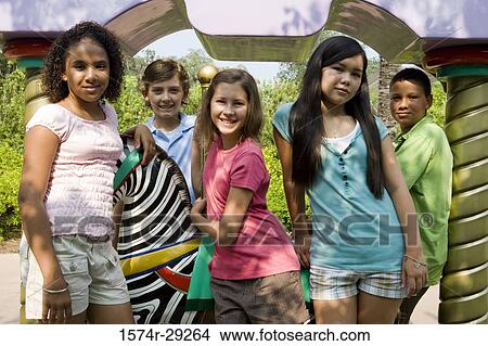 Picture - Portrait of cheerful teenagers standing together. Fotosearch