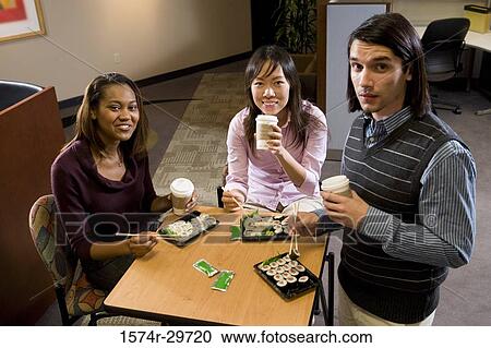 Portrait of friends sitting together and eating food View Large Photo Image Stock Image - Portrait of friends sitting together and eating food. Fotosearch
