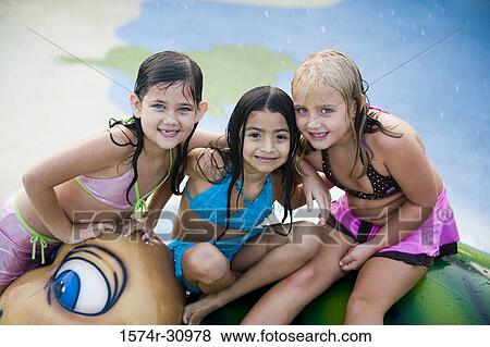 Portrait of girls sitting together on a tortoise sculpture View Large Photo Image Stock Photo - Portrait of girls sitting together on a tortoise sculpture. Fotosearch