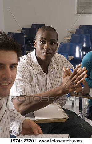 Portrait of male students with hands clasped in the classroom View Large Photo Image Stock Image - Portrait of male students with hands clasped in the classroom. Fotosearch