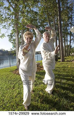 Portrait of mature couple practicing martial arts View Large Photo Image Stock Photo - Portrait of mature couple practicing martial arts. Fotosearch
